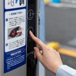 woman-using-electric-car-charging-station